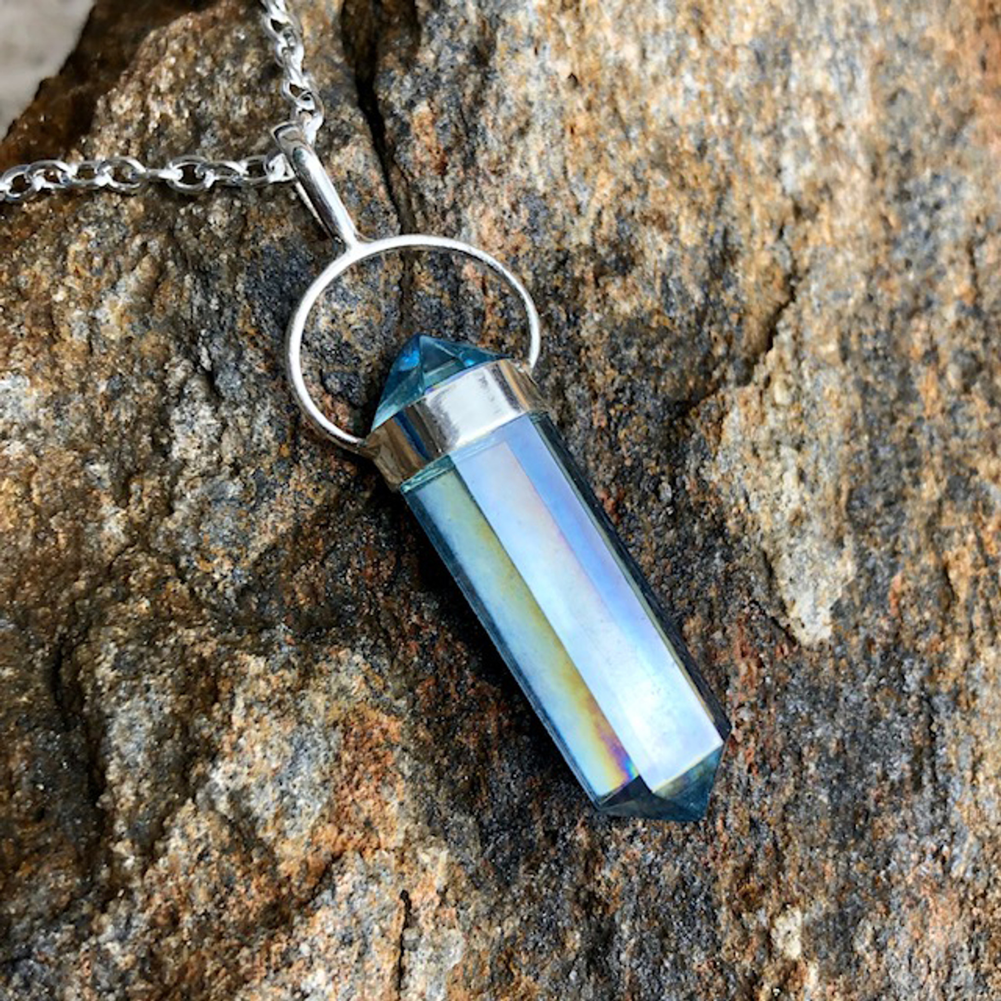 My aqua aura quartz necklace. It has INTENSE high vibrational energy. :  r/Crystals